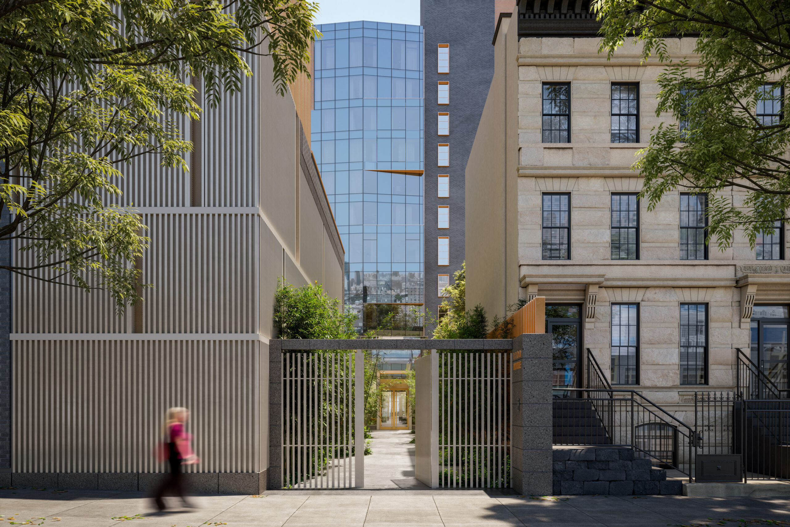 Street view of building exterior in the day with someone walking by