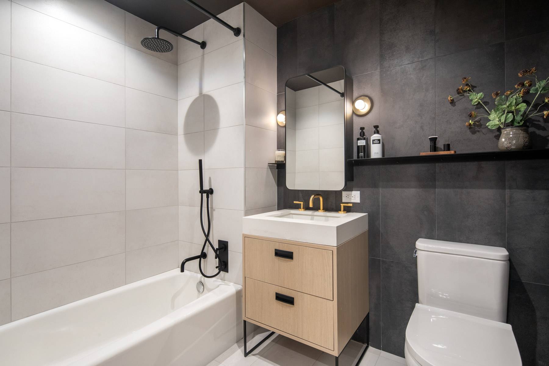 Secondary bath with modern tiles in shower and walls